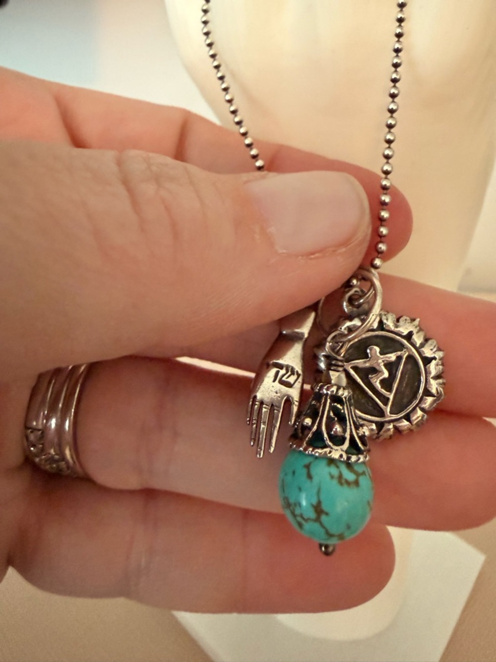 Silver Charm Necklace with Turquoise Bead Accent